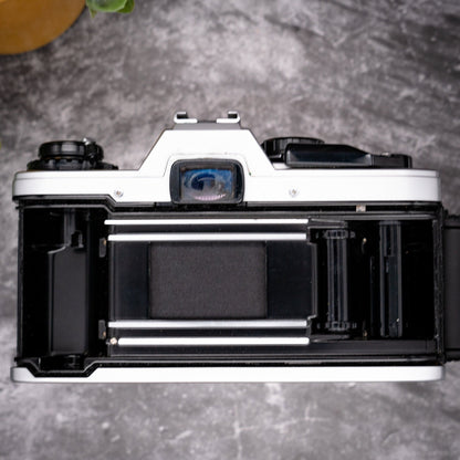 35mm Film Camera Kit | Olympus OM-10 + 50mm f/1.8 Lens, Manual Adapter, Roll Of Expired Film, Original Strap, Box & Instructions - Expired Film Club